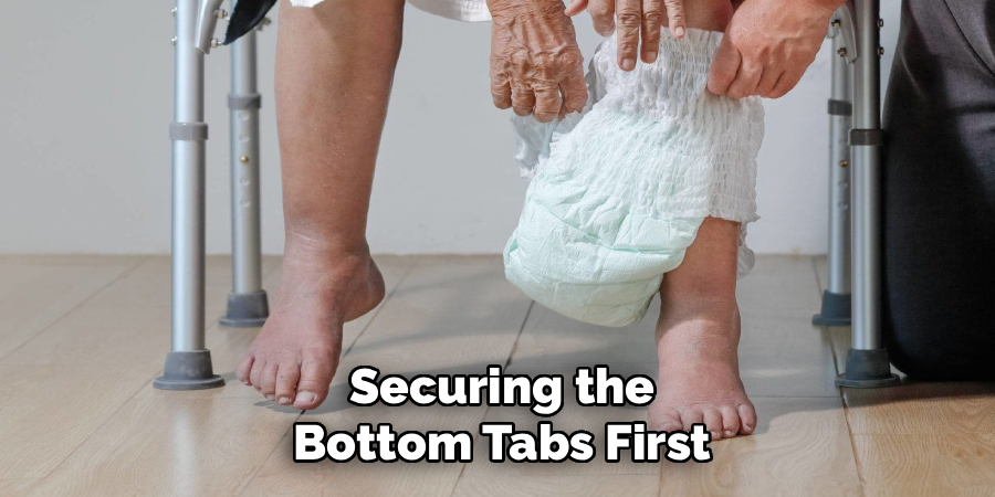 Securing the
Bottom Tabs First